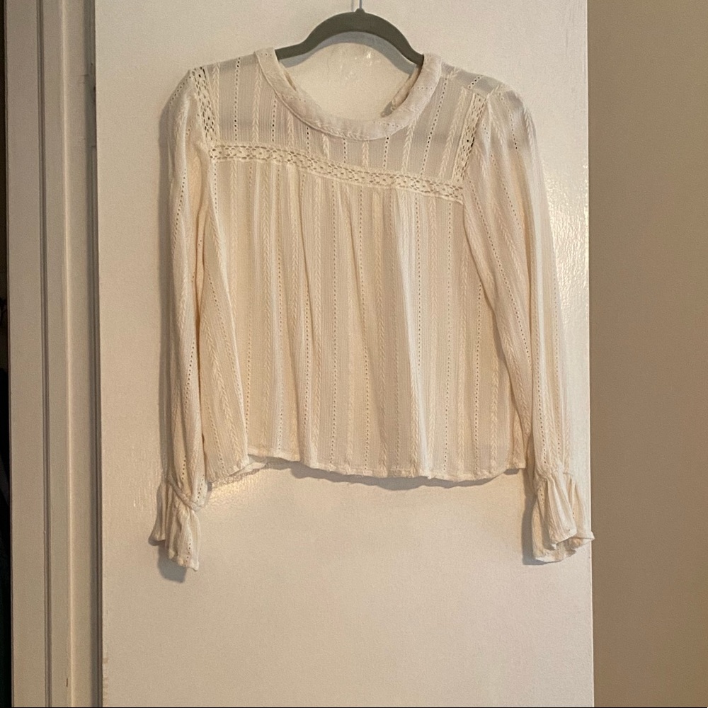 Francesca’s white blouse